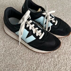 New Balance 237 women's sneaker in the black and bleach blue colorway